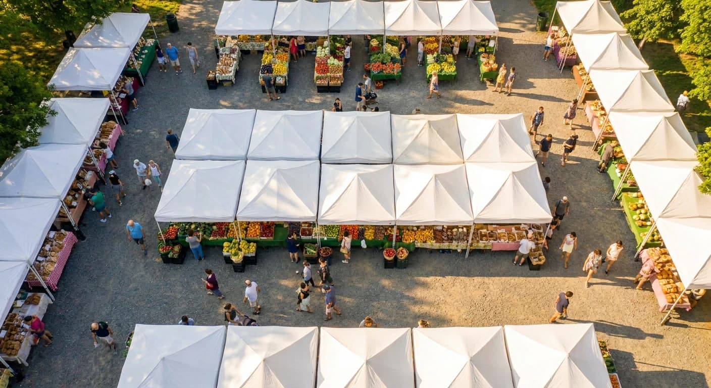 White-canopy farmers market in New York on a bright summer morning